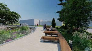 Zona de relaxare în parc cu bănci din lemn și plantări decorative.